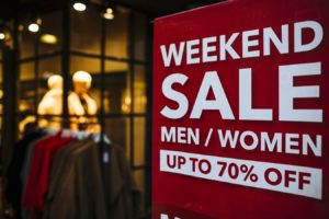 shop sign displaying weekend sale discount